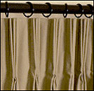 A drapery pleating system that is easy to use and is designed specifically for use by the drapery workroom operator who specializes in fabricating pleated drapery and pinch pleated curtains.